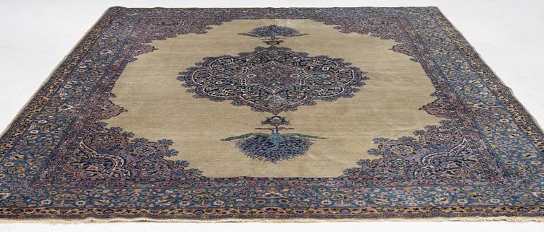 A semi-antique Kerman carpet, figural, c. 371 x 285 cm.