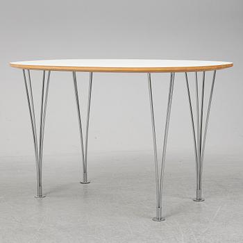A 'Superellips" table by Bruno Mathsson & Piet Hein for Mathsson International darted 2011.