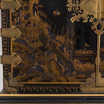 AN early 18TH CENTURY PROBABLY ENGLISH Japanned laquer cabinet on stand.