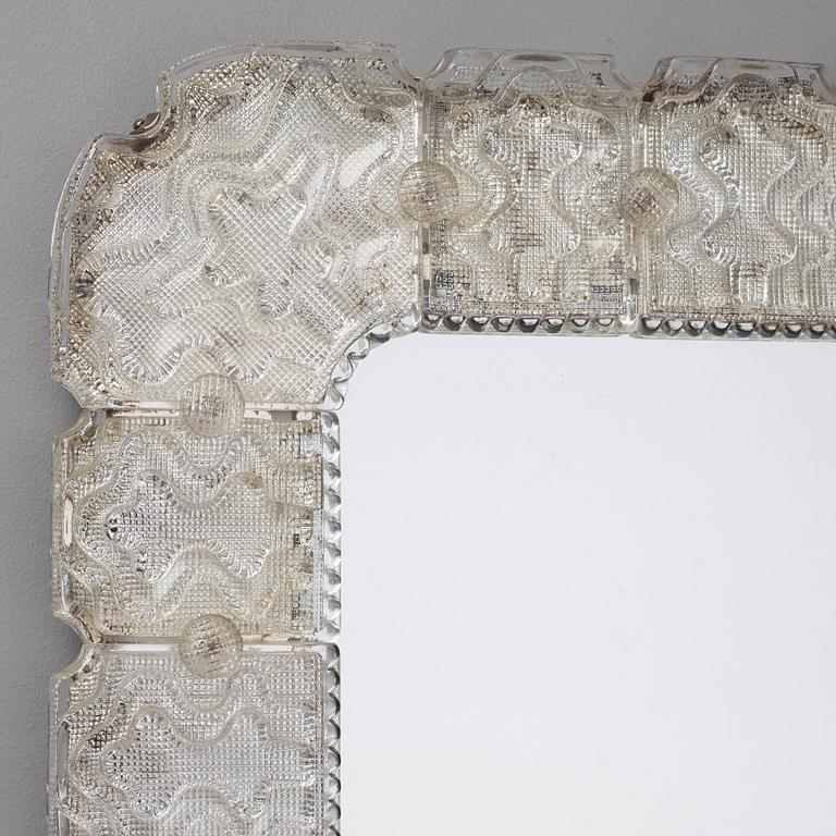 Carl Fagerlund, A Carl Fagerlund glass framed wall mirror, Orrefors, Sweden 1940-50's.