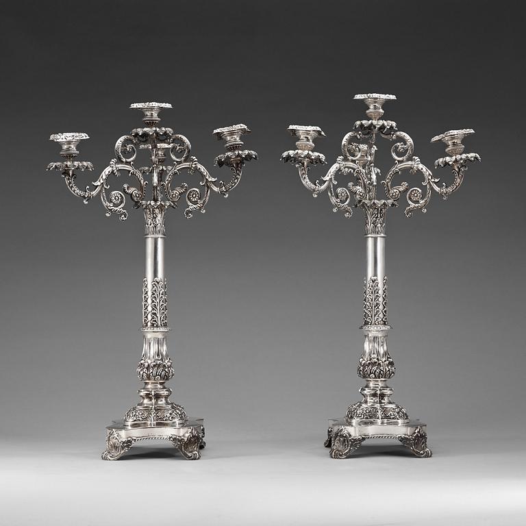 A pair of Swedish 19th century silver candelabras, marks of Gustaf Möllenborg, Stockholm 1838.