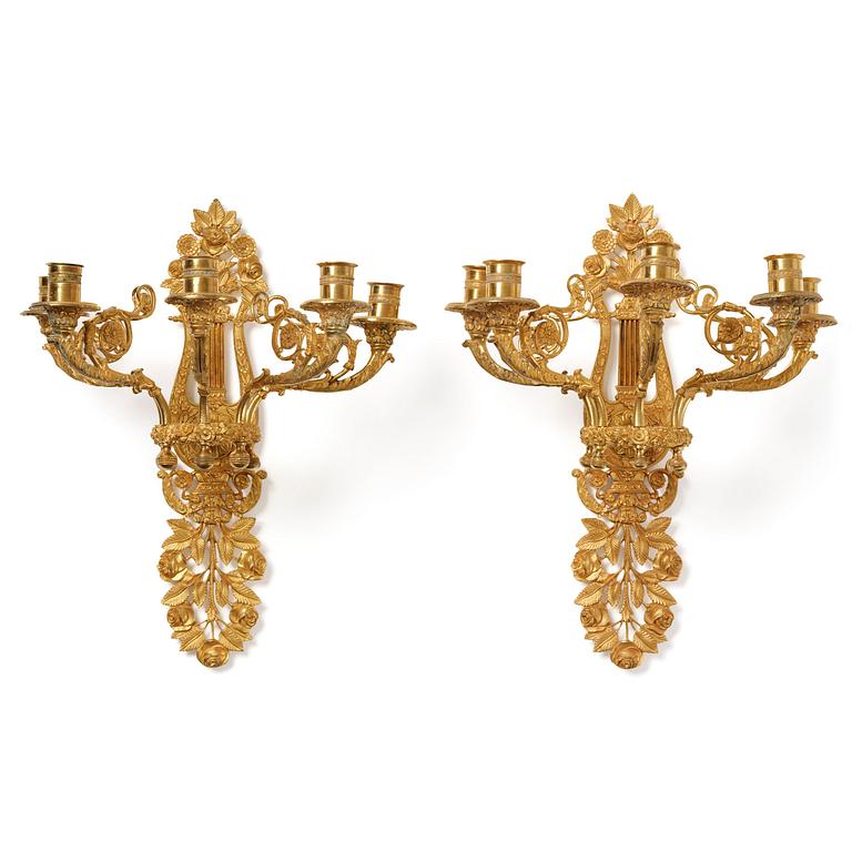 A pair of French 19th century gilt bronze five-light wall-lights.