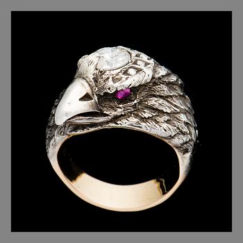 A RING, silver and 14K (56) gold, brilliant cut diamonds, rubies. Weight c. 13.3 g.