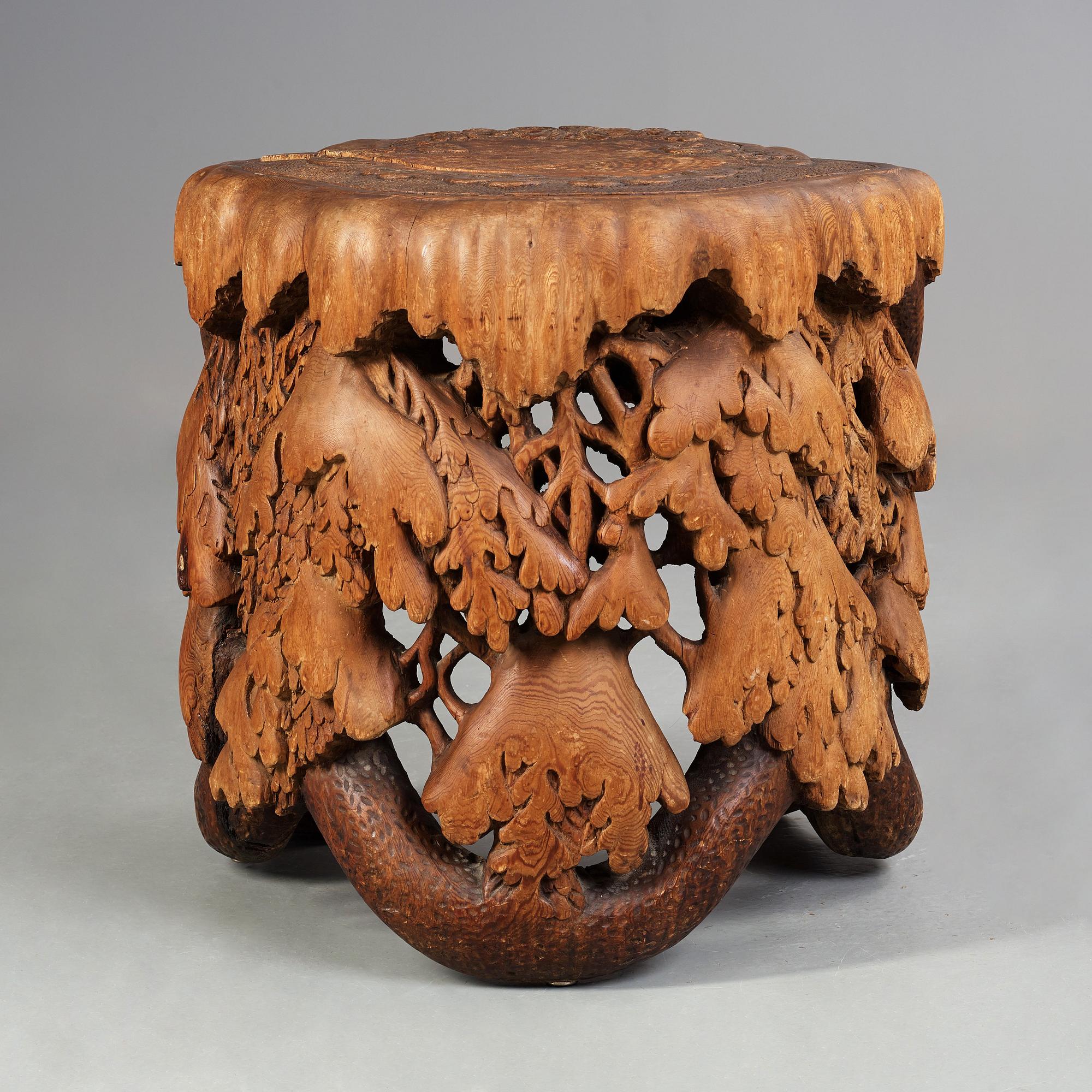 Knut Fjaestad, A Knut Fjaestad Art Nouveau sculptured pine table, Sweden ca 1900.
