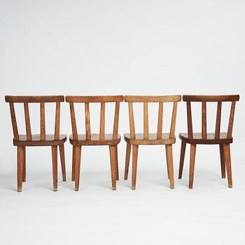 Axel Einar Hjorth, a set of four stained pine "Utö" chairs, Nordiska Kompaniet, Sweden 1930s.