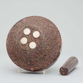 A Swedish porphyry mortar with pestel.