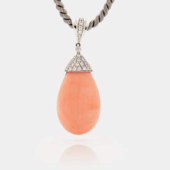 1057. An 18K white gold and coral pendant set with round brilliant-cut diamonds.