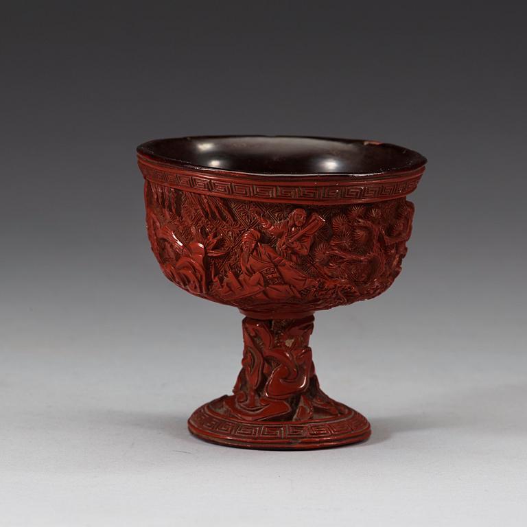 A carved cinnabar lacquer stem cup, Qing dynasty, 17th/18th Century.