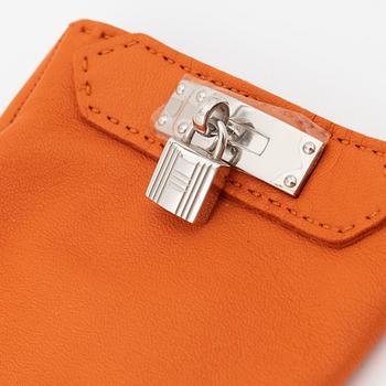 Hermès, a pair of orange kidskin and lambskin gloves, french size 8.