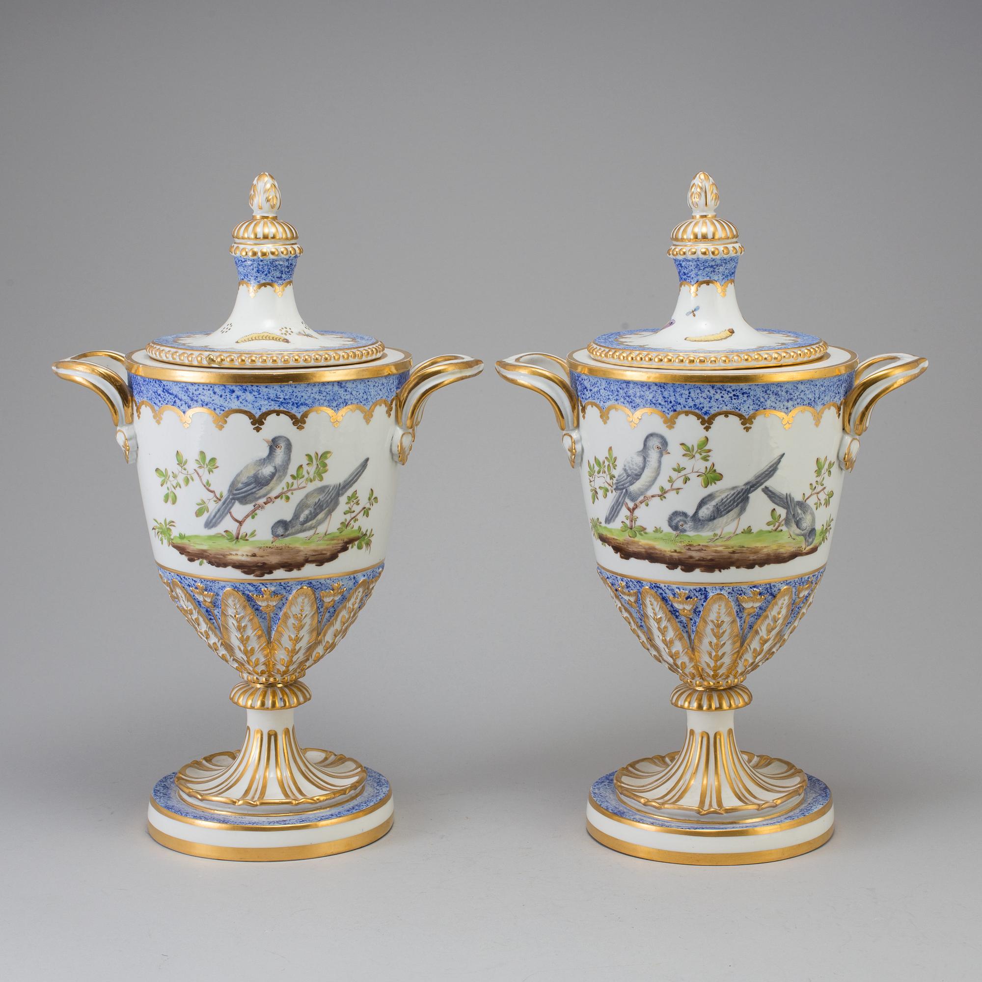 A pair of French 19th century porcelaine 
lidded vases with Sèvres style mark.