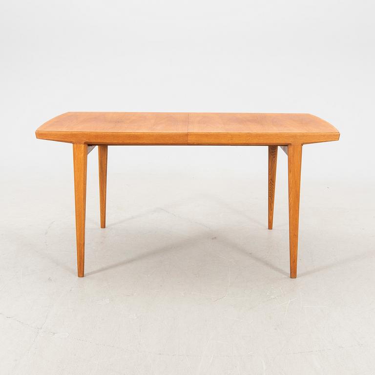 A 1950s teak dining table.