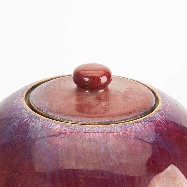 A sang de boef/flambe glazed jar with cover, Qing dynasty, circa 1900.