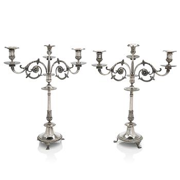 A pair of Empire silver candelabra, maker's marks of Pehr och Adolf Zethelius, Stockholm 1797 and 1824.