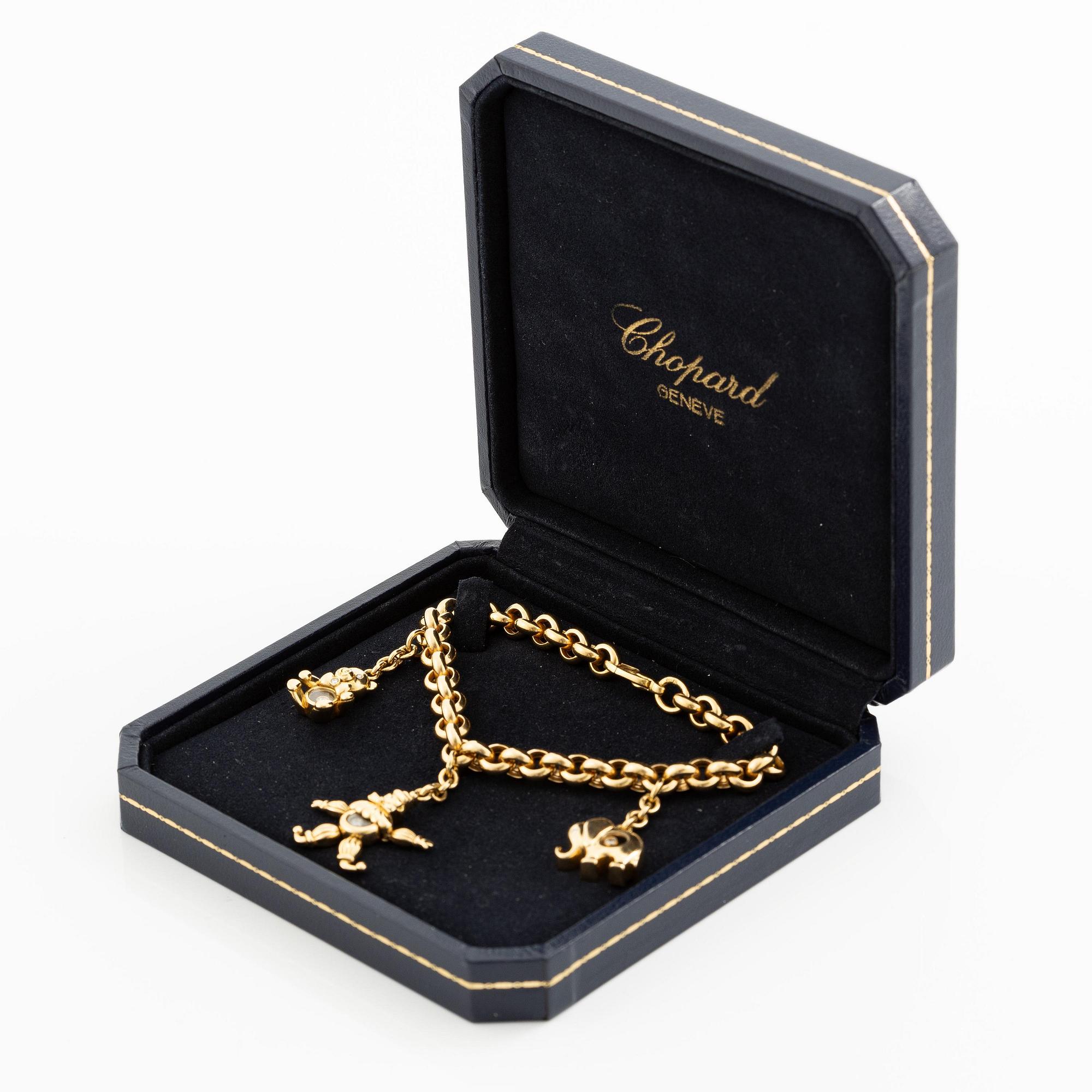 Chopard armband med berlocker 18K guld med runda briljantslipade diamanter.