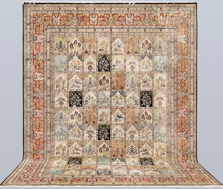 An oriental silk carpet, approx. 376 x 274 cm.