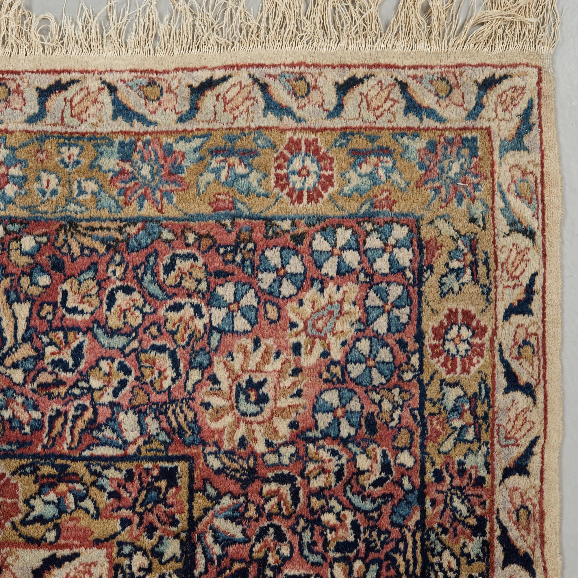 A semi-antique/old Kerman carpet, around 361 x 264 cm.