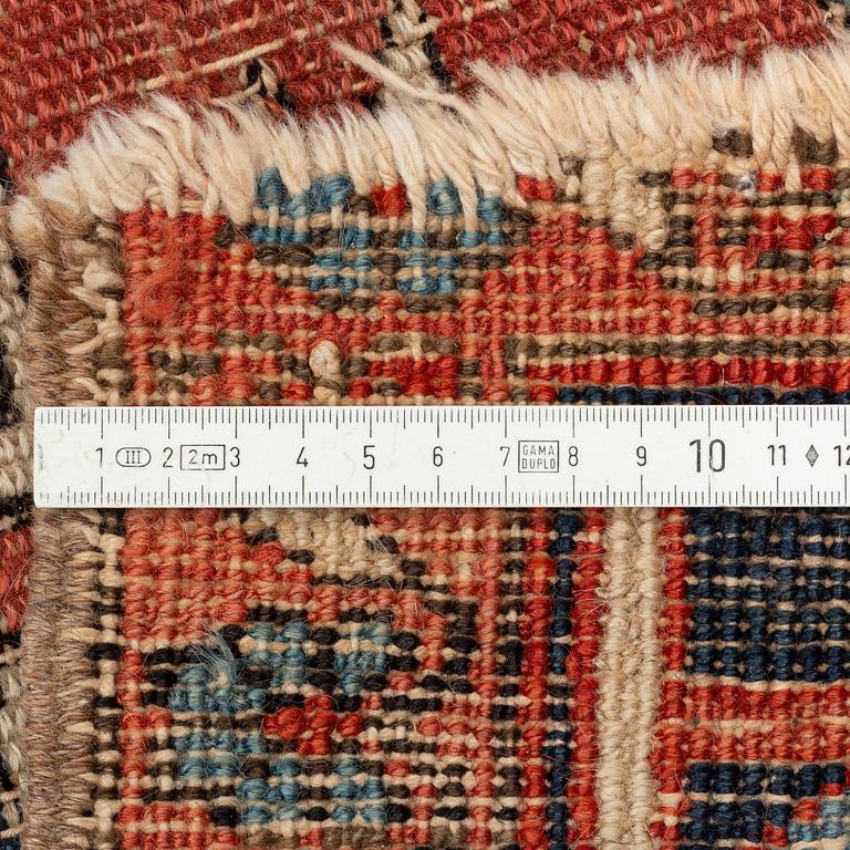 An antique Heriz carpet, ca 350 x 317 cm.