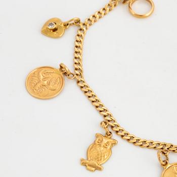 18K gold bracelet with charms.