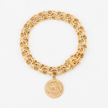 Bracelet, 18K gold Bismarck link, with charm.
