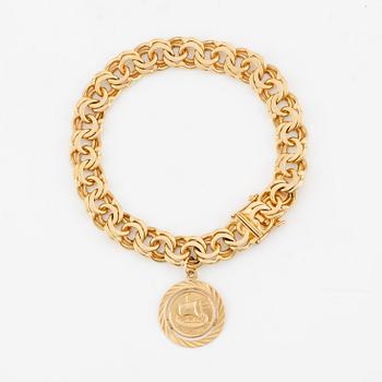 Bracelet, 18K gold Bismarck link, with charm.