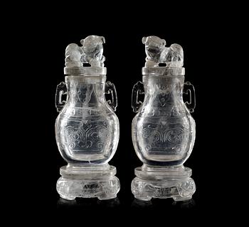 A pair of rock chrystal vases with covers, Qing dynasty.