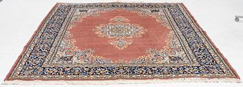 An carpet, possibly a Kerman, c. 310 x 230 cm.