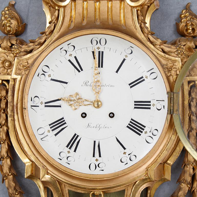 A gustavian style wall clock, signed Rob. Engström, Stockholm. First half of the 20th century.