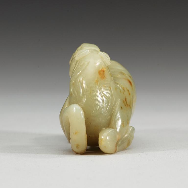 A carved nephrite figure of a reclining horse.