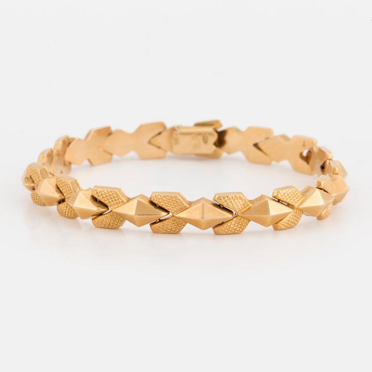 A fancy-link bracelet.