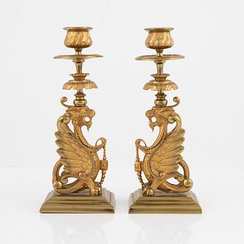 A pair of brass candleholders, 20th century.