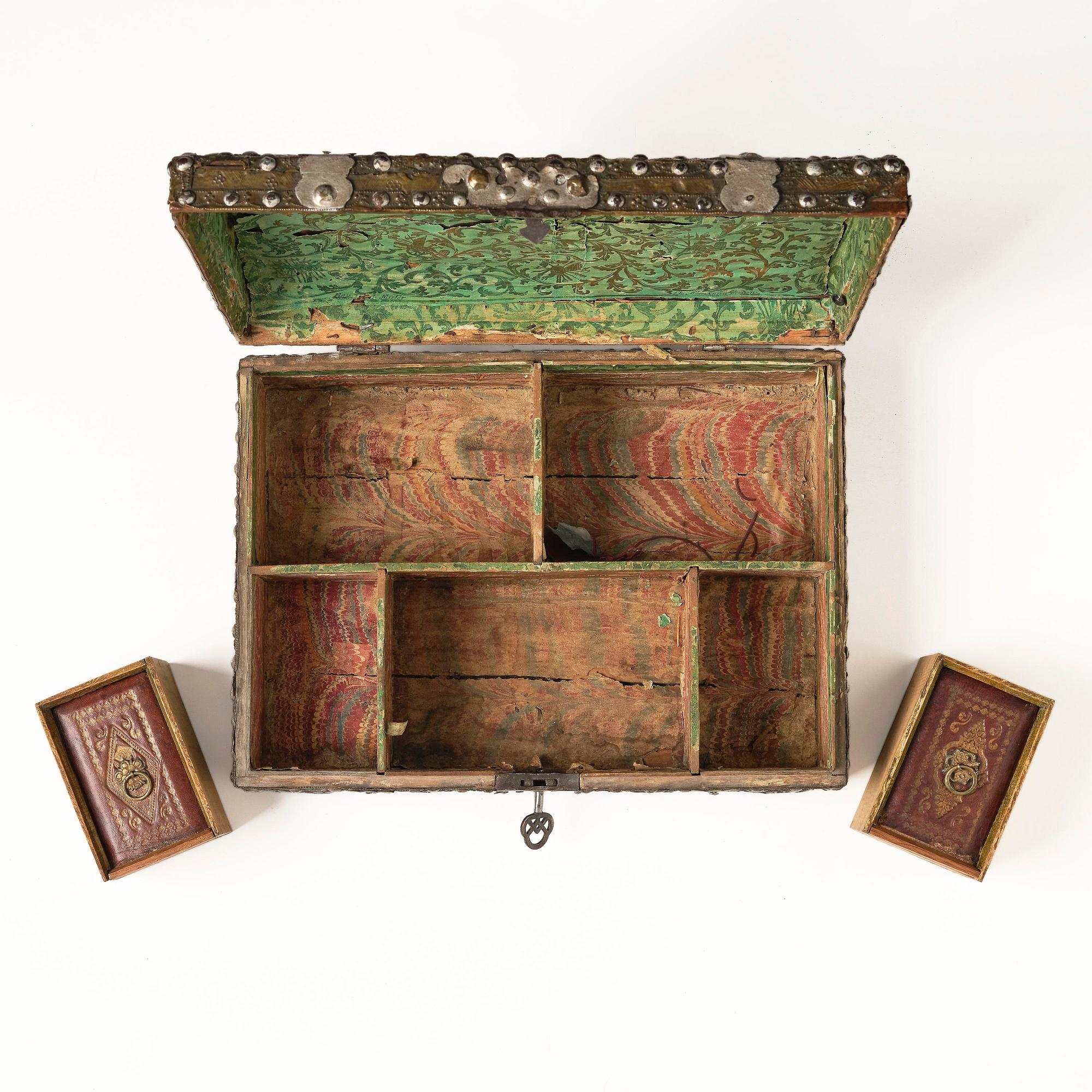 A presumably German baroque repoussé brass writing box, late 17th century.