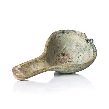 971. A painted pottery bell and a green glazed spoon, Han dynasty  (202 BC-220 AD).