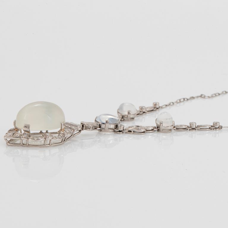 A platinum necklace set with moonstones and old- and eight-cut diamonds.