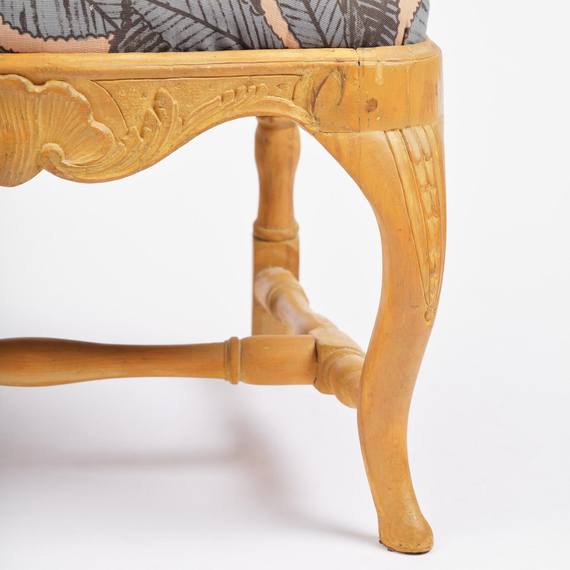 A pair of rococo open-back armchairs, Stockholm, later part 18th century.