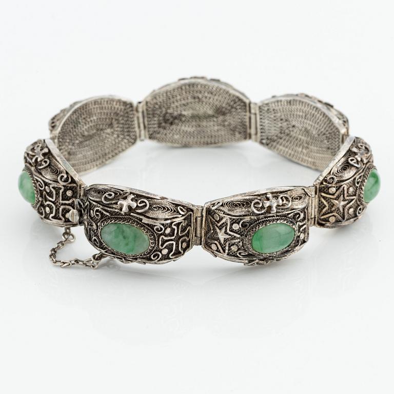 A Chinese silver and green stone bracelet and a pair of earrings, early 20th century.