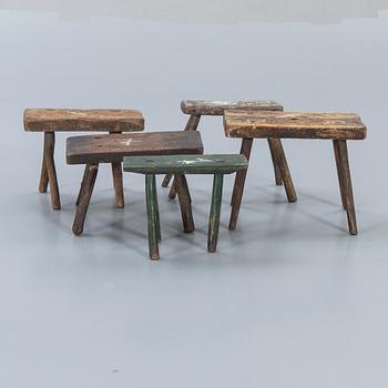 A set of five wooden stools around 1900.