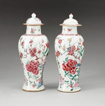 A pair of famille rose 'rooster' vases with covers, Qing dynasty, Qianlong (1736-95).