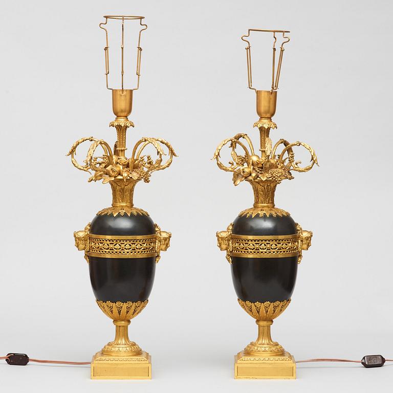 A pair of gilt and patinated bronze table lamps signed and dated by Henry Dasson 1877.
