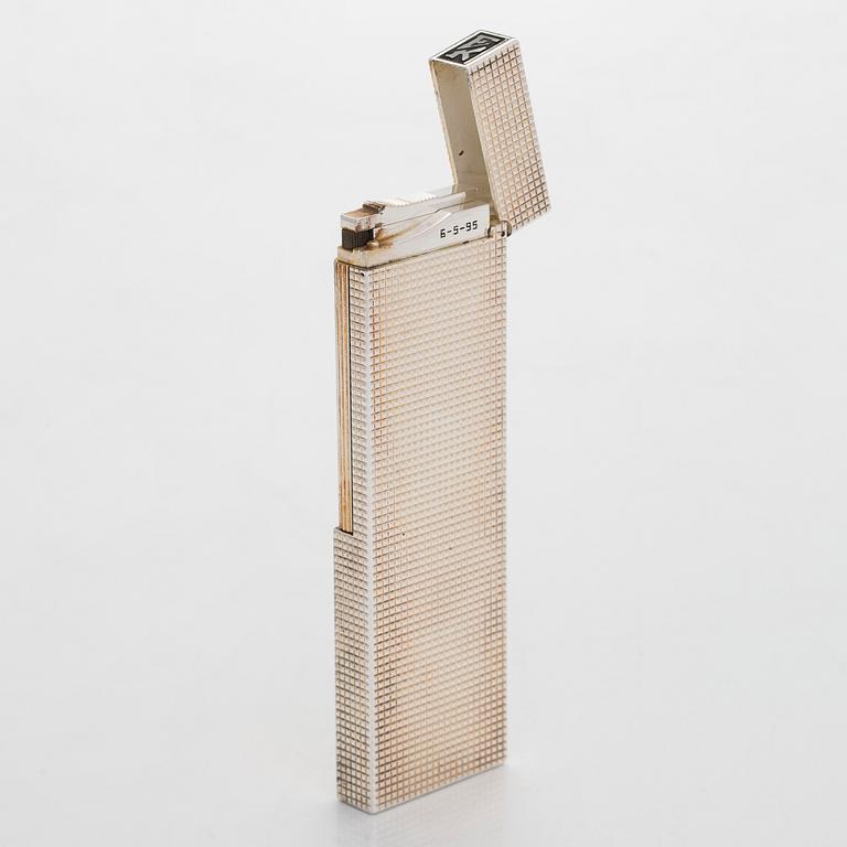 S.T. Dupont, a late 20th century table lighter.