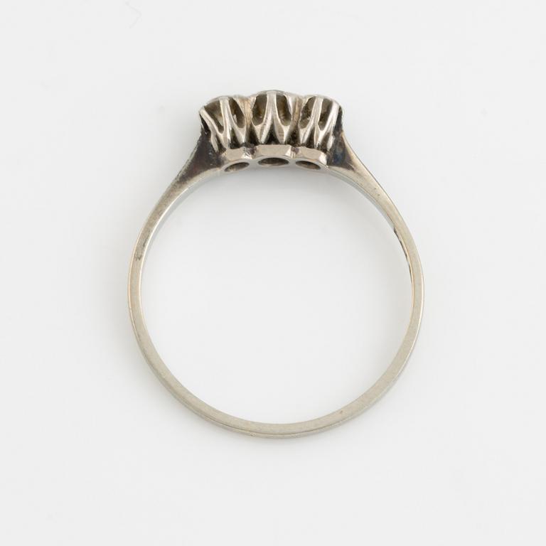 White gold and three brilliant cut diamond ring.