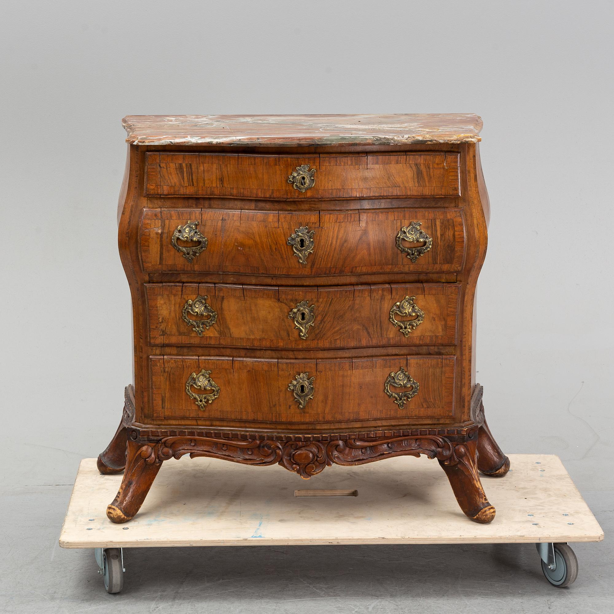 A 19th Century rococo style chest of drawers.