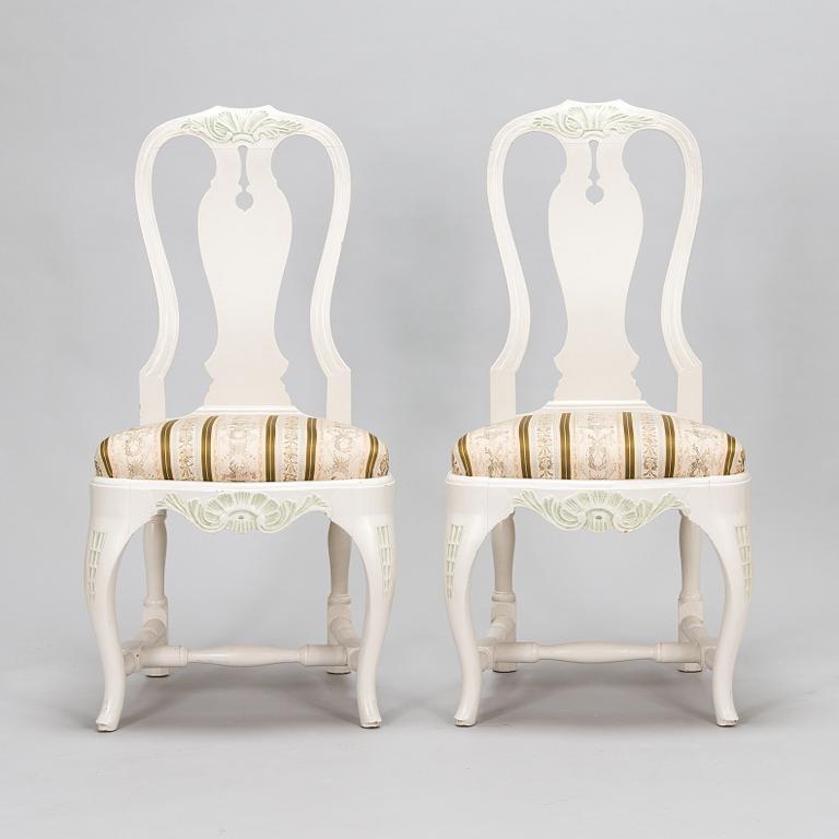 A pair of Rococo style armchairs, a pair of chairs, and a table, mid 20th century.