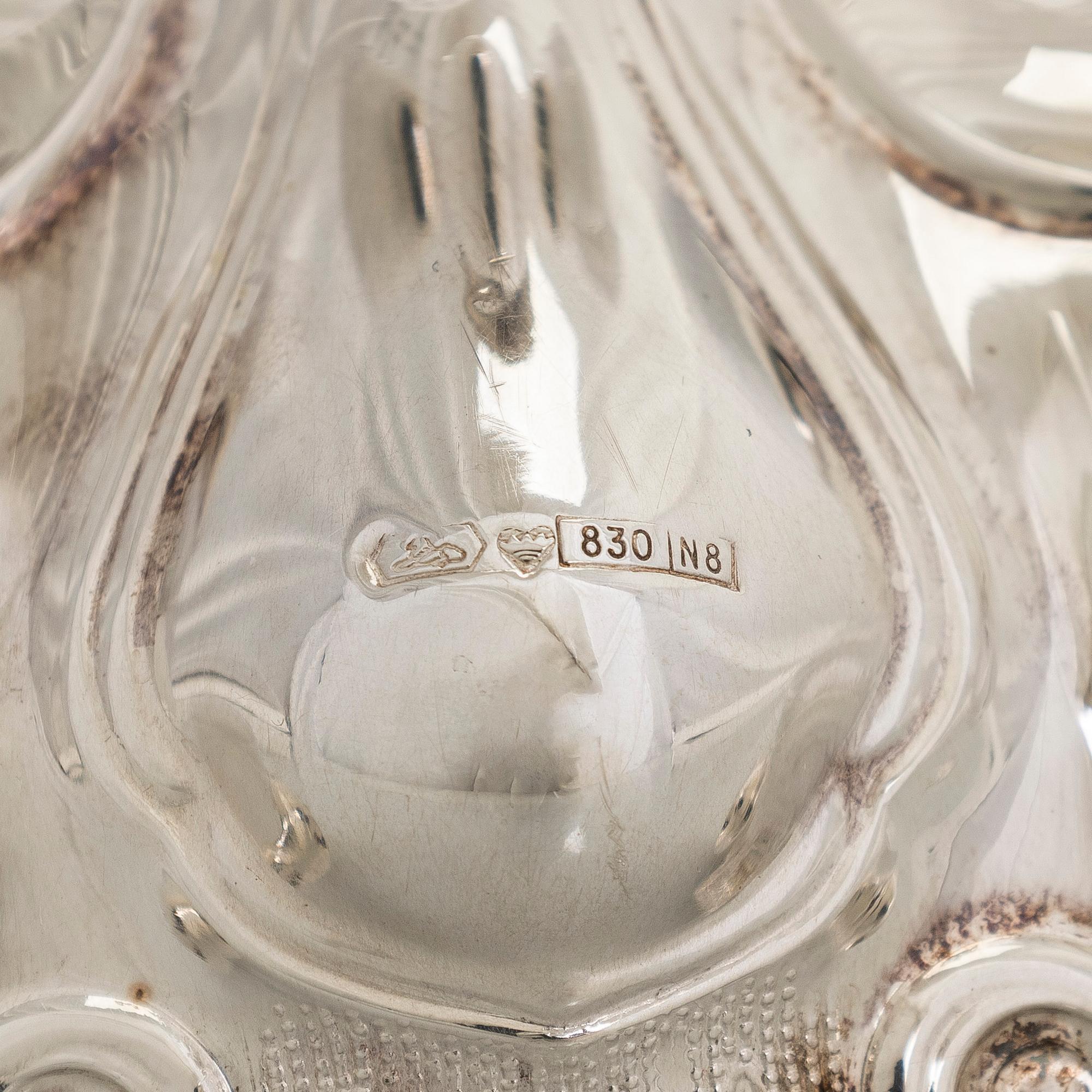 A baroque style silver candlestick, Kultakeskus, Tavastehus, 1990.
