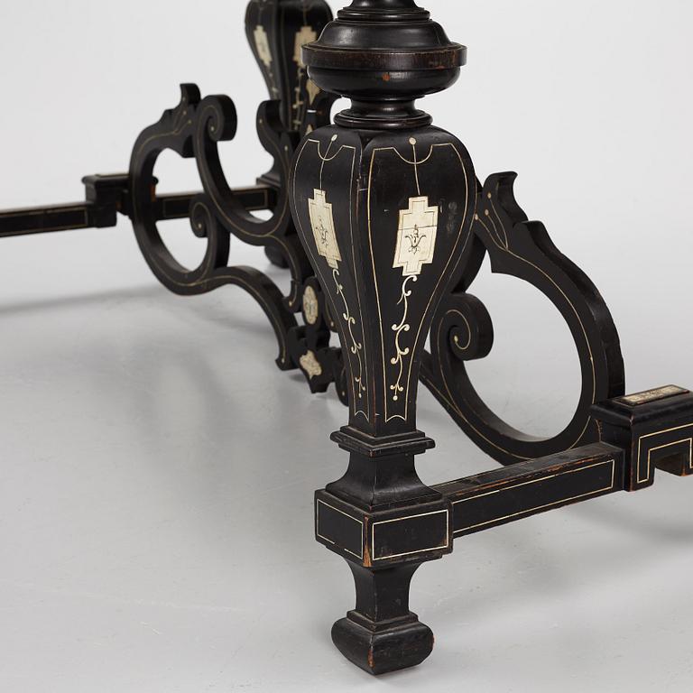A Renaissance-style ebony, ebonized and ivory-inlaid library table, late 19th century, presumably Germany.