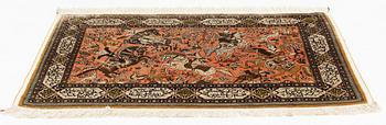 A rug, silk Quum, figural, ca 87 x 128 cm.