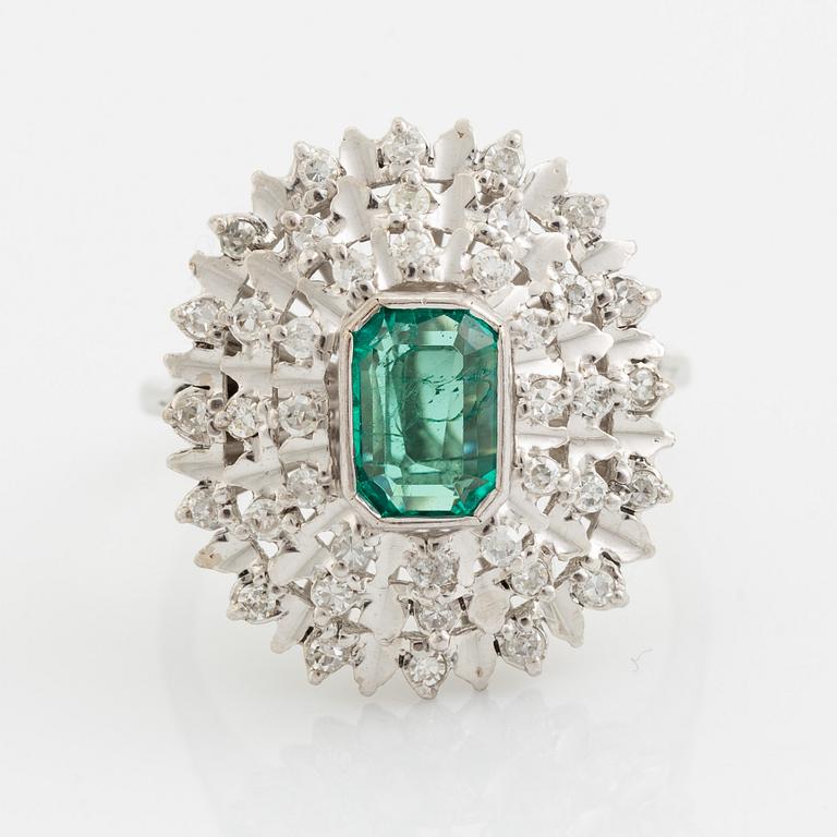 Emerald-cut emerald and eight cut diamond ring.