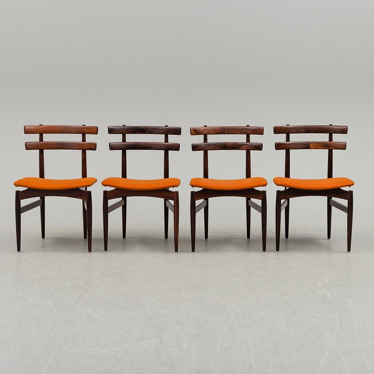 A dining table with four chairs by Poul Hundevad, latter part of 20th century.