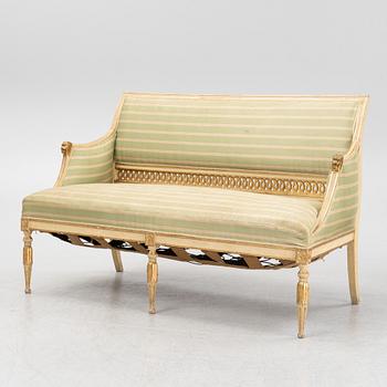A late Gustaivan style sofa and four matched chairs from around the year 1900.