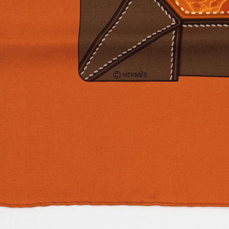Hermès, a 'Tout cuir' silk scarf.