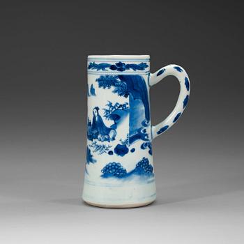 387. A blue and white Transitional tankard, 17th century.